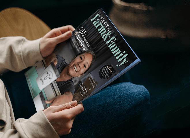 Hands holding a copy of the Florida Farms & Family magazine