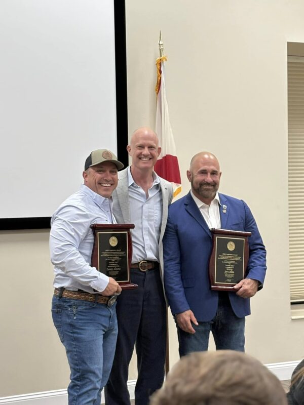 Sen. Jay Collins, Rep. Danny Alvarez, and Florida Farm Bureau President Jeb Smith holding Legislator of the Year plaques