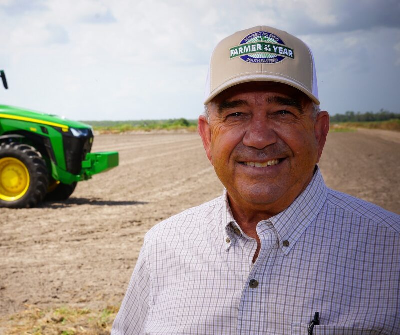 Headshot of Wade Purvis, 2023 Florida Farmer of the Year, posing for a photo outside.