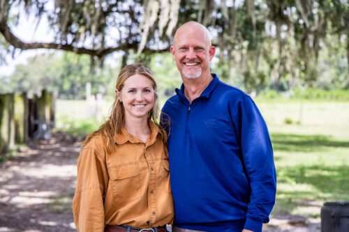 Kelsey Waters-David and Jeb S. Smith standing outside.